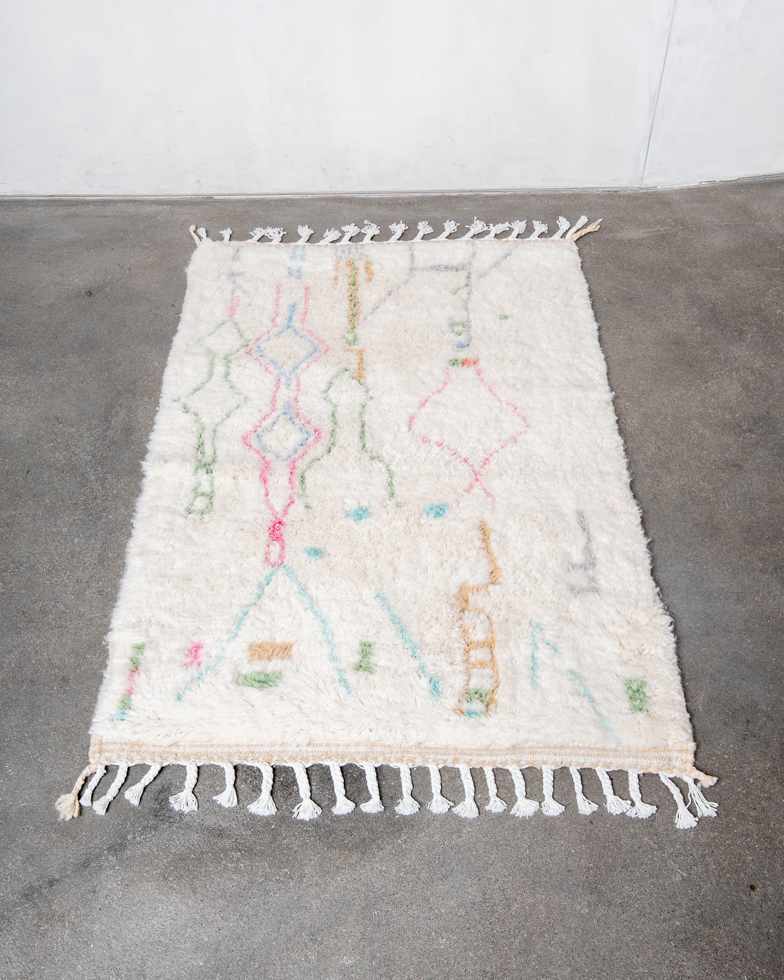 Modern, designer, handcrafted Berber rug from Morocco. Beniourain carpet with beautiful colours and patterns and fluffy wool texture.